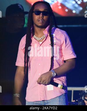 **FILE PHOTO** Migos Rapper, Takeoff, Reportedly Killed at 28. MIAMI, FLORIDA - FEBRUARY 01: Migos - Takeoff performs during the 2020 Vewtopia Music Festival at Marlin's Park in Miami, Florida. Photo: Alex Pesantes/imageSPACE/MediaPunch Stock Photo