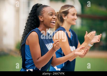 Sports, support and netball team cheers, applause or celebrate teamwork goal, game win or competition victory. Winner, motivation and diversity Stock Photo