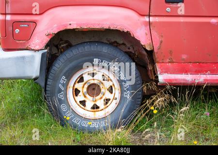 Rusting wheel arch on an old car, UK Stock Photo