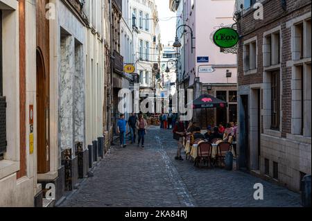 Cobble stone street in Old Town, Brussels with restaurants, bars and shops Stock Photo