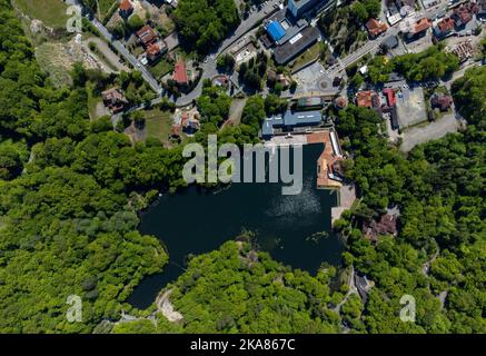 Aerial landscape with Ursu Lake in Sovata resort - Romania. It is the largest heliothermal lake in the world with the highest saline concentration Stock Photo