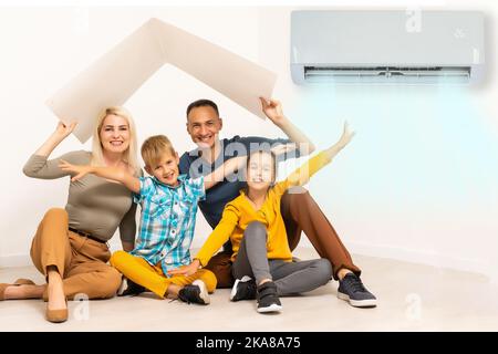 Happy Family Under Air Conditioning Stock Photo