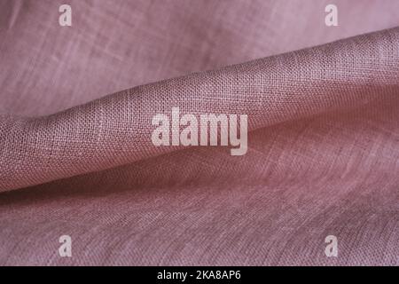 Wrinkled linen cloth folded napkins. Natural linen fabric texture. Textured fabric background. Concept of using natural eco-friendly materials Stock Photo