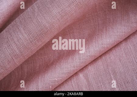 Wrinkled linen cloth folded napkins. Natural linen fabric texture. Textured fabric background. Concept of using natural eco-friendly materials Stock Photo