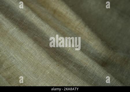 Wrinkled linen cloth folded napkins. Natural linen fabric texture. Textured fabric background. Concept of using natural eco-friendly materials Stock Photo
