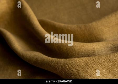 Wrinkled linen cloth folded napkins. Natural linen fabric texture. Textured fabric background. Concept of using natural eco-friendly materials Stock Photo