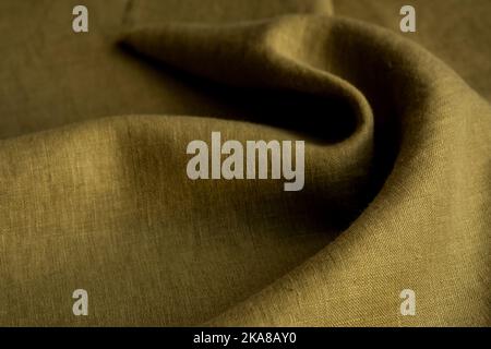 Wrinkled linen cloth folded napkins. Natural linen fabric texture. Textured fabric background. Concept of using natural eco-friendly materials Stock Photo