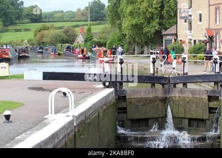 Lock gates at stoke Bruerne canal in n Northamptonshire, United Kingdom. Barges coming through locks. Very popular for sight seers and barges. Stock Photo