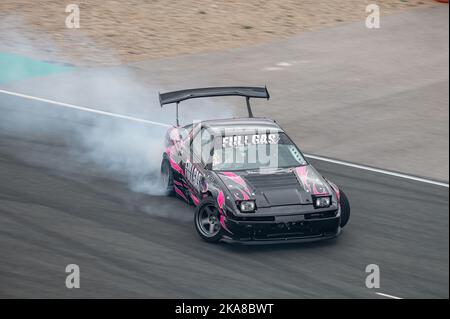 Toyota Supra with pink vinyl drifting Stock Photo