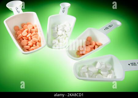 Measuring Spoons with Tablets Stock Photo