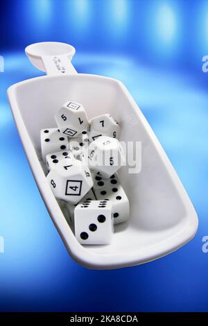 Measuring Spoons with Dice Stock Photo