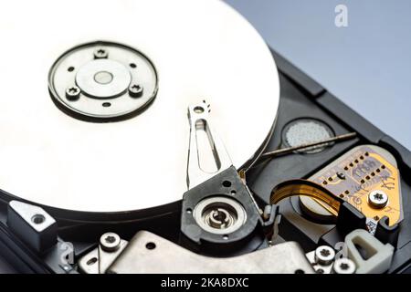 Generic 3.5 hard drive HDD disk without top cover closeup, object detail, nobody. Simple digital data storage device abstract concept, no people. Rest Stock Photo