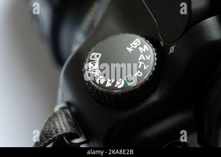 Canon photo camera settings dial set to M, manual mode, object detail, symbols extreme closeup. Learning photography, photo course, training abstract Stock Photo