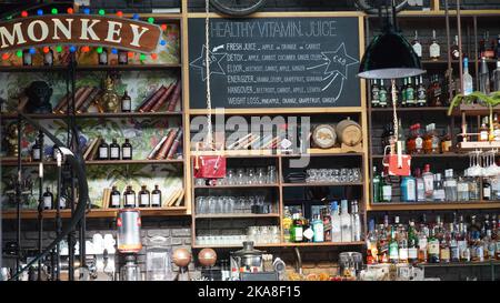 Limassol, Cyprus - October 10, 2022:Different brands of booze,  or alcohol in a bar or tavern. Multiple bottles of adult beverages. Wine, whisky, liq Stock Photo