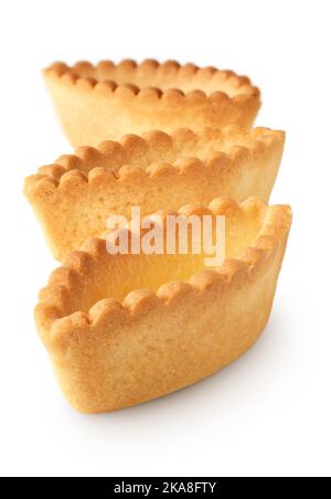 Group of empty tartlets, tart shells, isolated on white background Stock Photo