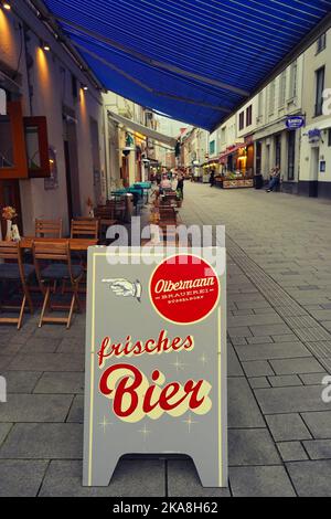 Advertisement with logo of the local craft brewery Olbermann in the Old Town of Düsseldorf/Germany. Stock Photo