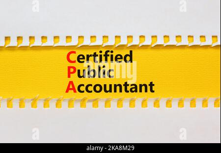 CPA certified public accountant symbol. Concept words CPA certified public accountant on yellow paper on a beautiful white background. Business and CP Stock Photo