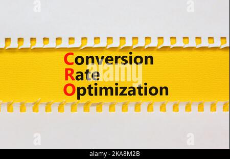 CRO conversion rate optimization symbol. Concept words CRO conversion rate optimization on yellow paper on a beautiful white background. Business CRO Stock Photo