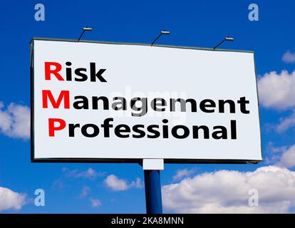 RMP risk management professional symbol. Concept words RMP risk management professional on billboard on a beautiful blu sky background. Business RMP r Stock Photo