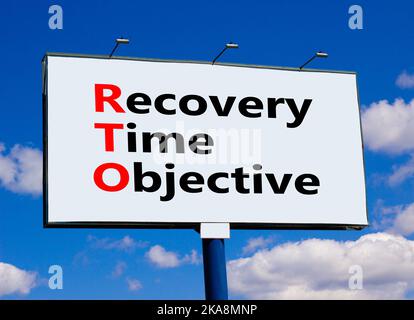 RTO recovery time objective symbol. Concept words RTO recovery time objective on billboard on a beautiful blu sky background. Business and RTO recover Stock Photo