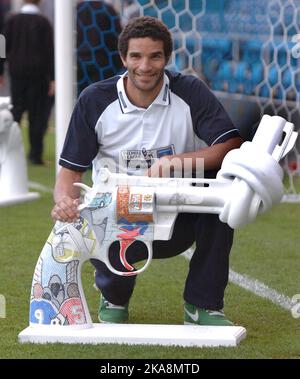 England goalkeeper David James has joined the war on gun crime by posing with schoolchildren and mini replicas of the world famous non-violence sculptor created for John Lennon outside the United Nations. James and pupils from city of Portsmouth Boys' School, Portsmouth, Hants, lined up with a series of sculptures of guns with their barrels tied up to show his support for the Premier League's 'Knot Violence' programme. Portsmouth star James, 38, said: 'Unfortunately violent crime is, in some form, everywhere. What we are trying to do is target the next generation of adolescents. Prevention is Stock Photo