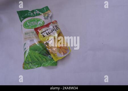 Packaged rice and cooking oil on a white background Stock Photo