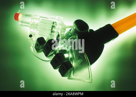 Robotic Hand with Water Pistol Stock Photo