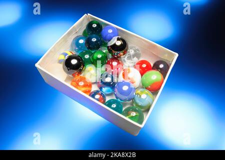 Marbles in Box Stock Photo