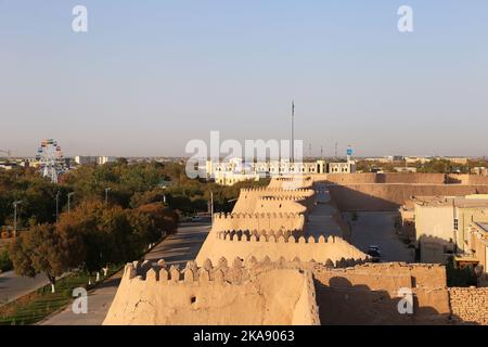 City Walls from Kunya Ark Palace roof terrace at sunset, Ichan Kala (Inner Fortress), Khiva, Khorezm Province, Uzbekistan, Central Asia Stock Photo