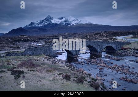 A view of old Sligachan Bridge and Cuillins at dusk, Isle of Skye, Scotland Stock Photo