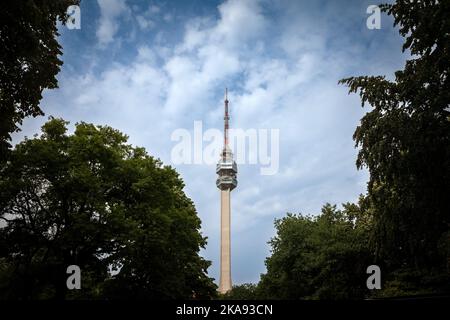 Picture of the Avala tower seen from the nearby forest. The Avala Tower is a 204.68 m tall telecommunications tower located on Mount Avala, in Belgrad Stock Photo