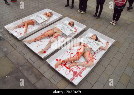 London, UK. 01st Nov, 2022. PETA (People for the Ethical Treatment of Animals) activists seen packaged as “Free-range human meat” during a protest outside Whole Foods store next to Piccadilly Circus on World Vegan Day to highlight the fact that 'humane' labels on meat are meaningless, to remind people of the horrors of the meat industry, and to promote veganism. Credit: SOPA Images Limited/Alamy Live News Stock Photo
