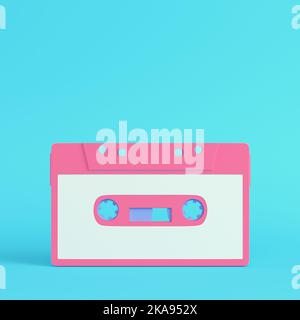 Pink vintage audio tape on bright blue background in pastel colors. Minimalism concept. 3d render Stock Photo