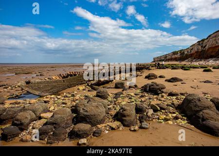 The wreck of the steam trawler Sheraton on the beach below St Edmund's Point in Old Hunstanton on the north Norfolk coast in eastern England UK. Stock Photo