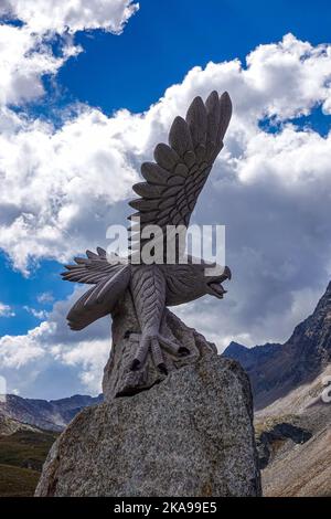 Stone eagle sculpture, Timmelsjoch Pass on the Italy Austria border in Autumn in the Oetztal Valley Austria, Tirol, Alps, Alpine, Stock Photo