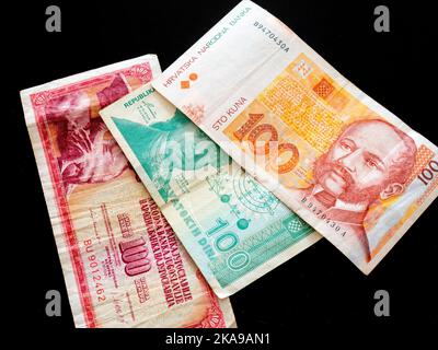 Croat Croatia three banknotes of 100 Yugoslav Dinar Dinars Croatian Dinars and Kuna Kune Kunas on Black background Stock Photo