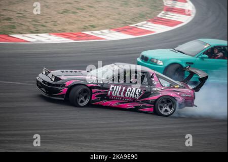 Toyota Supra with pink vinyl drifting Stock Photo