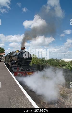 Steam locomotive No. 4079 'Pendennis Castle' emitting steam at Didcot Railway Centre, Didcot, Oxfordshire Stock Photo