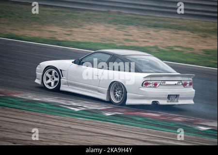 White Nissan Silvia S13 drifting on the racing circuit Stock Photo - Alamy