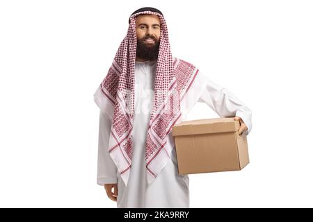 Saudi arab man in a thobe holding a cardboard box isolated on white background Stock Photo