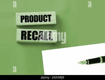 Product Recall written on a wooden blocks on red. Business concept. Warranty and quality control. Stock Photo