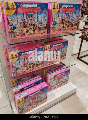 Berlin, Germany, October 2019: Large pink boxes of Playmobil advent calendars with figures and details and blocks inside on the theme of Christmas. So Stock Photo