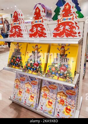 Berlin, Germany, October 2019: a Variety of advent calendars with chocolates and sweets MM and Celebrations on the shelf in the store. Stock Photo