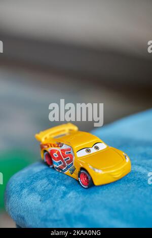 A vertical shot of Mattel Cruz Ramirez and Lightning McQueen toy model ...