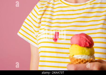 Dirty strawberry ice cream stain on clothes.  Stock Photo