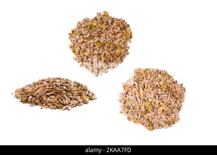 Mix of seeds for a salad. A pile of mixed seeds isolated on a white background. Stock Photo