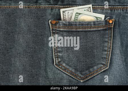 100 dollar bills in pants pocket hi-res stock photography and images