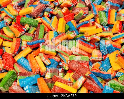 Colorful gummy candies. Top view, flat lay. Background of delicious sweets. Stock Photo