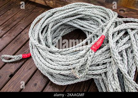 Colorful ropes and rigging. Charter and commercial fishing boats in the harbor, Kodiak, Alaska, USA. Stock Photo