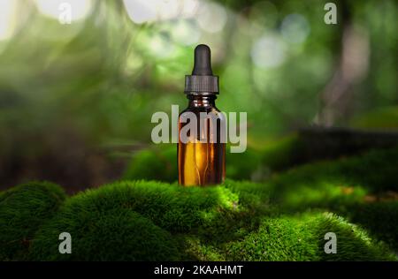 Dropper bottle mockup. Bottle of dark amber glass with essential oil. Stock Photo